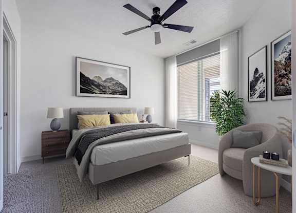 an apartment bedroom with a bed and a ceiling fan