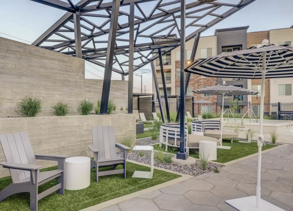 a rendering of a patio area with chairs and umbrellas
