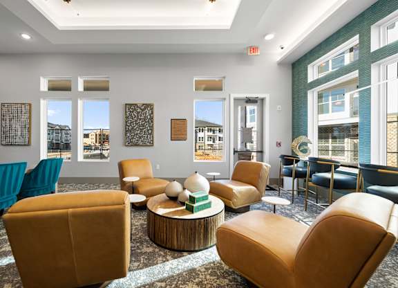 A room with a large window and a view of a building outside.