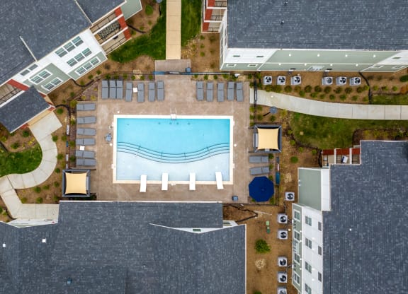 arial view of a swimming pool in the middle of a building