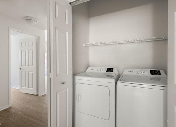 A laundry room with a washer and dryer.