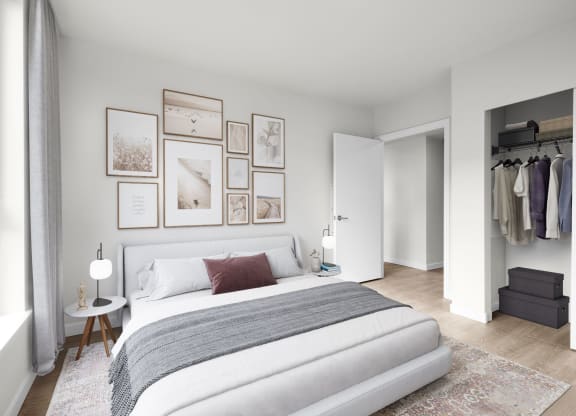 a bedroom with a bed and a dresser in a room at Ion Town Center, Washington, 98133