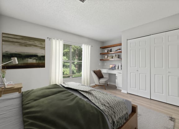 a bedroom with a bed and a desk with a window