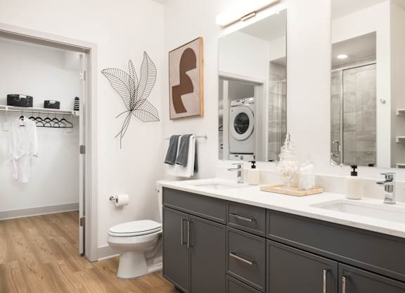 A bathroom with a white toilet and a sink.