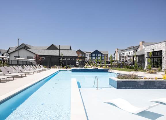 A large swimming pool with a blue line in the middle.