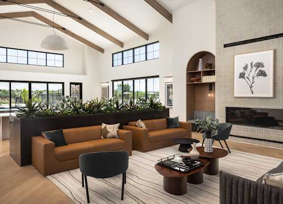 A living room with a fireplace and a large window.