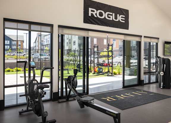 A gym with a sign that says "ROGUE" above the door.