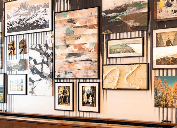 Wall of pictures on display in a gallery at The Allaso Peak, Colorado Springs, CO