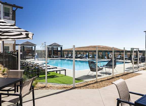Pool with lounge chairs at The Allaso Peak, Colorado Springs, Colorado