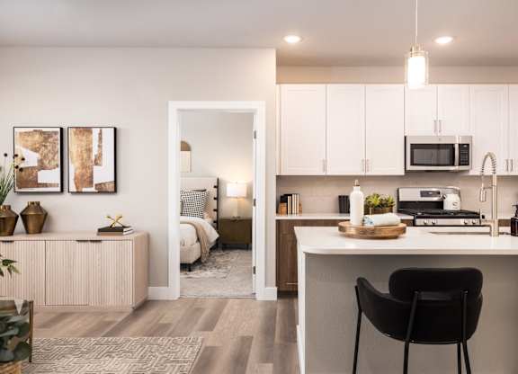 Kitchen with white cabinets at The Allaso Peak, Colorado, 80907