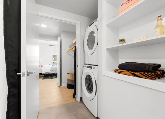 a small laundry room with a washer and dryer at Ion Town Center, Shoreline, WA