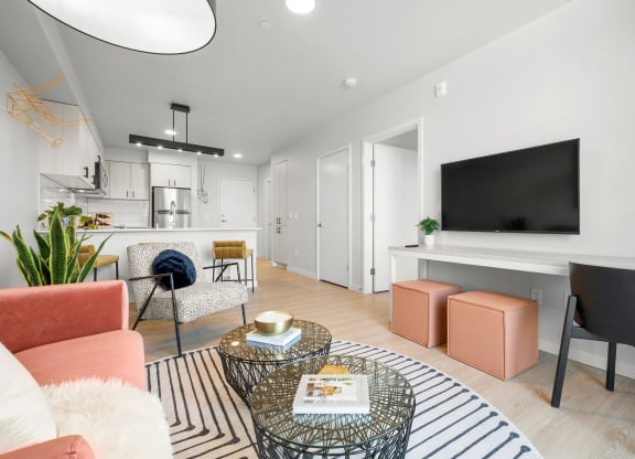 a living room with white walls and hardwood floors at Ion Town Center, Shoreline, WA 98133