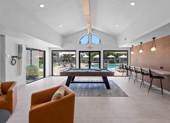 Clubhouse with pool table and seating area at La Privada in North Scottsdale, AZ