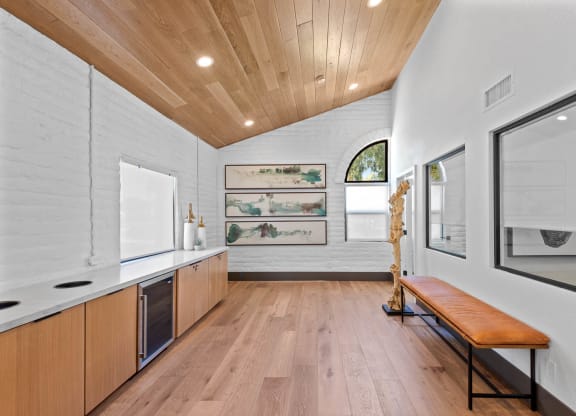 Resident Café lounge with wood floors and white walls