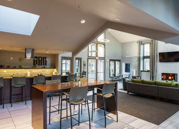 A modern kitchen with a bar area and a skylight.