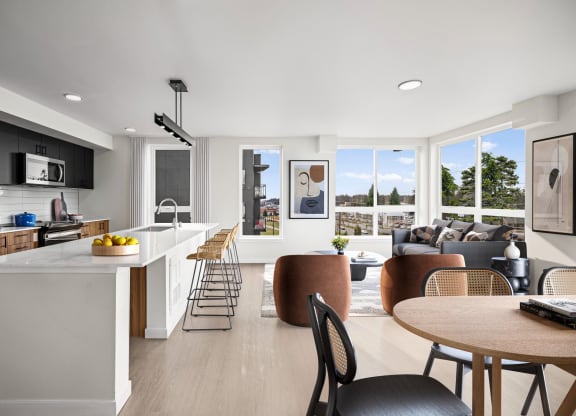a kitchen and living room with white walls and hardwood floors at Ion Town Center, Shoreline