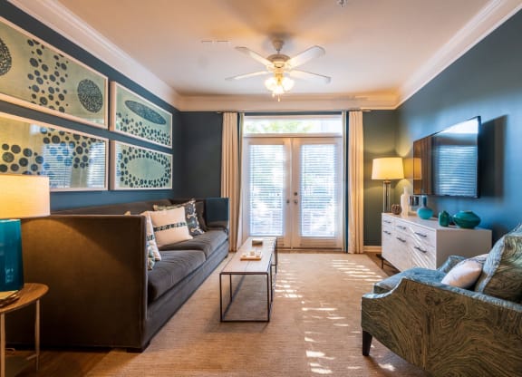 Sofa And Ceiling Fan in Living Room at Oberlin Court, Raleigh