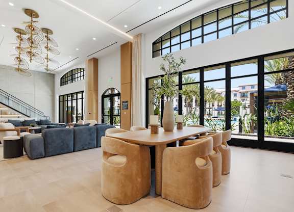 A large room with a long table and chairs.