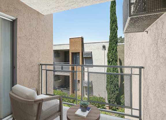 A personal balcony with a chair and table.