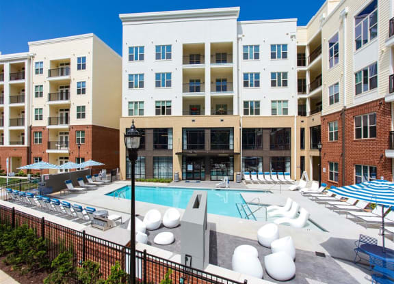 a swimming pool at an apartment building with a pool