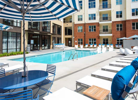our apartments have a large pool and lounge chairs