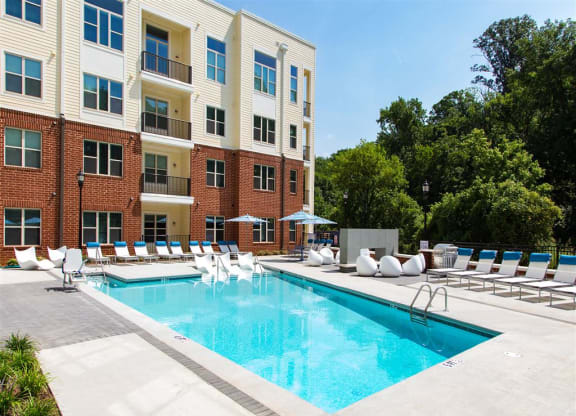 a swimming pool in front of a building