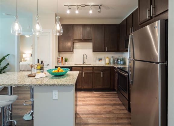 a kitchen with stainless steel appliances and a counter top
