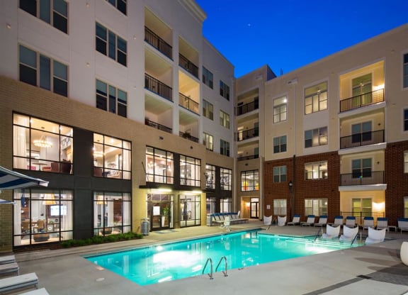 a swimming pool in the middle of an apartment building