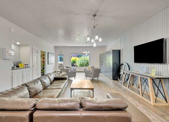 A modern living room with a large sectional sofa and a flat-screen TV.