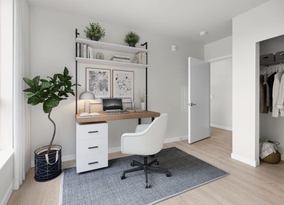 a home office with a desk and a chair in a 555 waverly unit at Ion Town Center, Shoreline, 98133