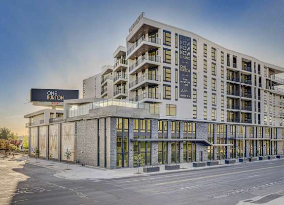 A modern building with the sign "ONE BURTON" on the left side.