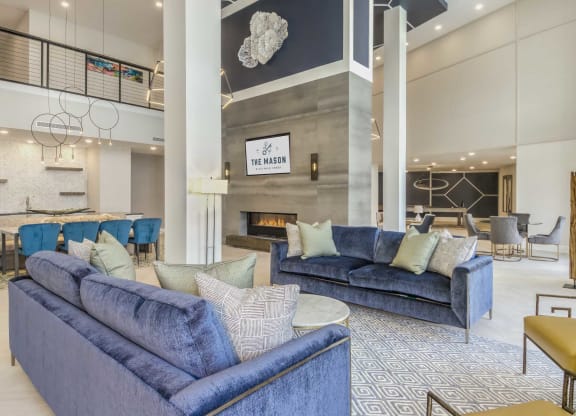 a living room with couches and a fireplace