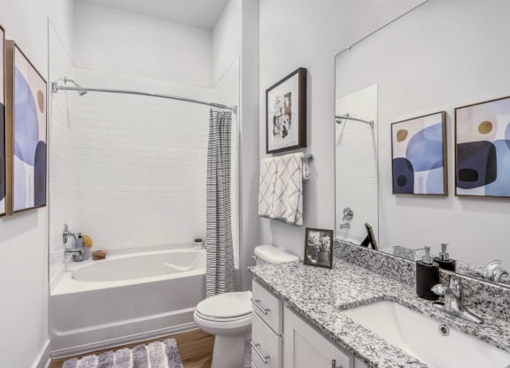 a bathroom with a sink and a toilet and a tub
