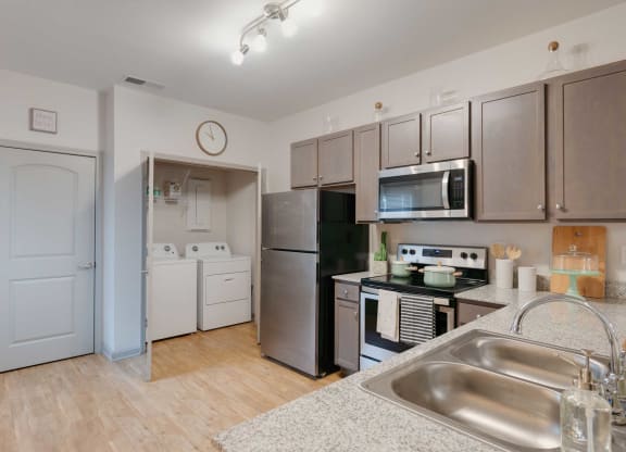 a kitchen with stainless steel appliances and a sink