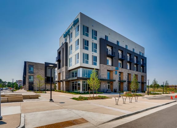 main view of the building with parking lot and street