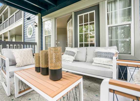 Outdoor balcony with seating and coffee table