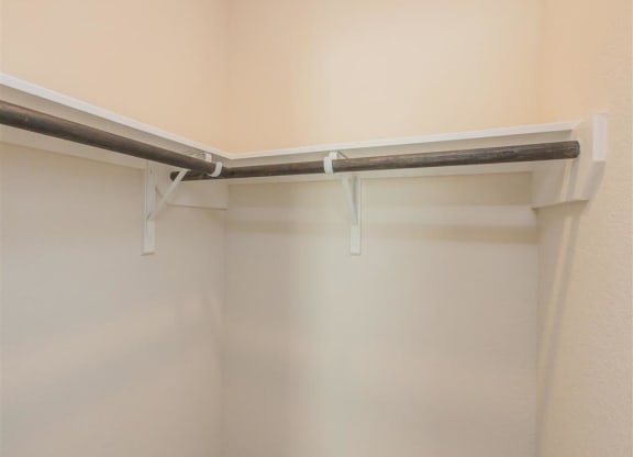 a walk in shower in a bathroom next to a wall at The Village at Granger Pines, Conroe, 77302