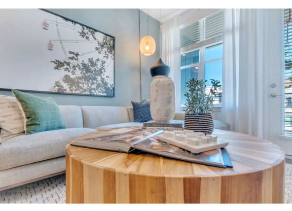 a living room with a table and a couch