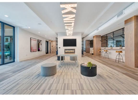 a large room with a fireplace and a television in the middle