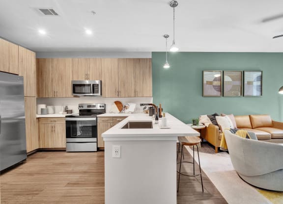 a living room with a kitchen and a dining room