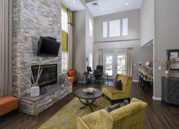 a living room with a fireplace and a television
