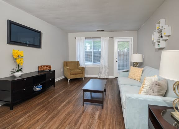 a living room with a couch and a tv