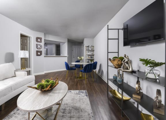 a living room with a couch and a table and a television