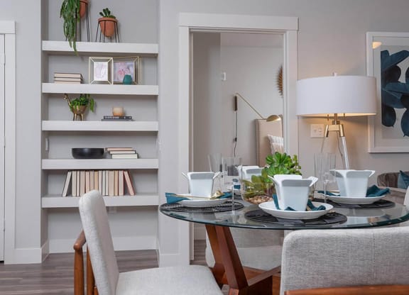 a dining room with a table and chairs