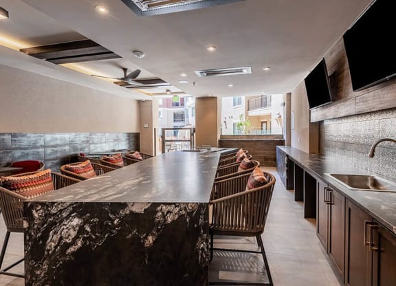 a large bar in a restaurant with chairs