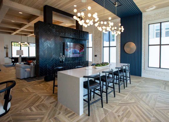 a dining room with a long table and chairs in a lobby