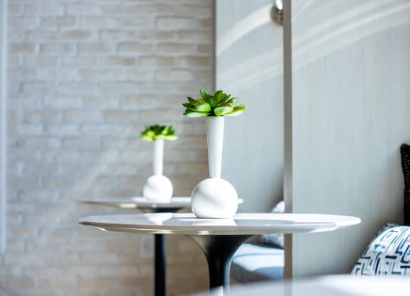 a small table with a vase on top of it