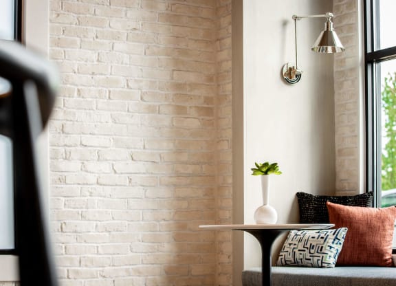 a living room with a couch and a table and a window