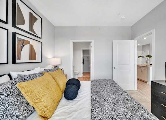 a bedroom with a bed and a closet