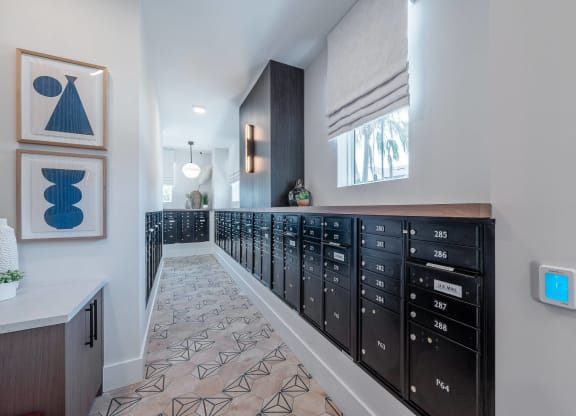 a long room with a long row of drawers and a wall with a window